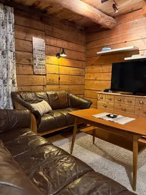 a living room with a couch and a coffee table at Rugsund Handelsstad in Rugsund