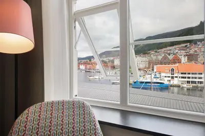 a room with a window looking out at a harbor at Scandic Torget Bergen in Bergen