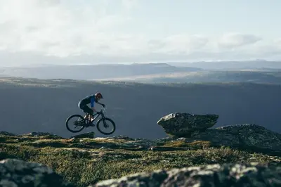 a person riding a bike on top of a mountain at Gaustablikk Fjellresort in Gaustablikk