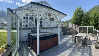 a gazebo on the deck of a house at Jølster Holiday home in Skei