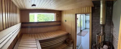 a sauna with a bench and a window at Jølster Holiday home in Skei