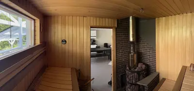 a room with a staircase in a house with a window at Jølster Holiday home in Skei