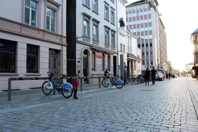 a group of bikes parked on a city street at MB Apartments in Bergen