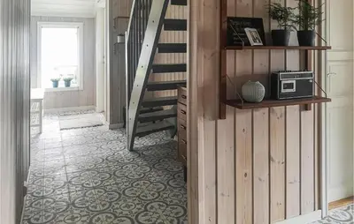 a hallway with a staircase and a microwave on a shelf at Stunning Home In Hebnes With Kitchen in Hebnes