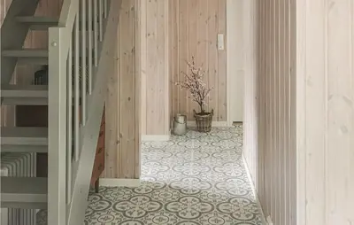 a hallway with a staircase and a tile floor at Stunning Home In Hebnes With Kitchen in Hebnes