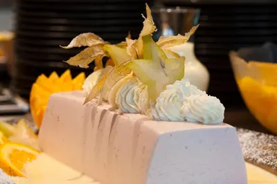 a white cake sitting on top of a table at Strand Fjordhotel in Ulvik