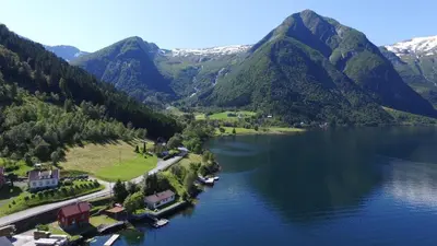 an aerial view of a lake with mountains at Der Fjordtraum in Balestrand direkt am Wasser in Balestrand