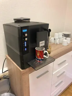 a microwave sitting on a counter with a coffee mug at Kirkegata 4 in Ålesund