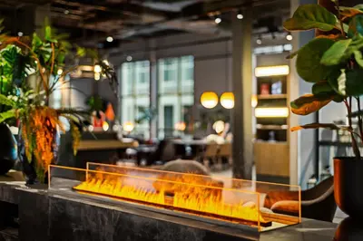 a counter with a fire place in a restaurant at Quality Hotel Ålesund in Ålesund