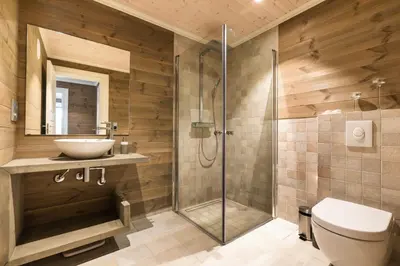 a bathroom with a shower and a toilet and a sink at Lastølen 3 bedrooms in Brunstad