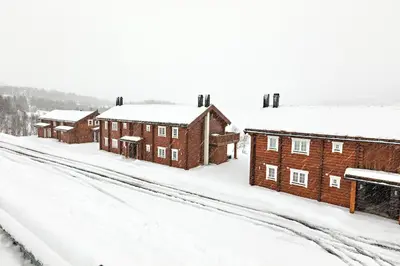 a row of brick buildings in the snow at Lake View Apartment 4 bedrooms in Brunstad