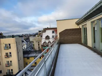 a balcony with a view of a city at Veversmauet Apartments in Bergen