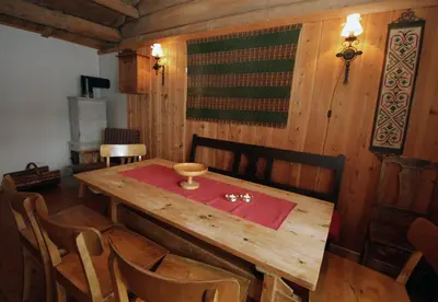 a wooden table with a red napkin on top of it at Putten Seter in Høvringen