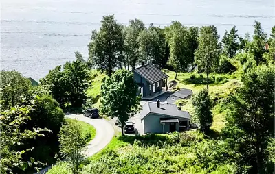 a house on a hill next to a road at Stunning Home In Seim With Wifi in Seim
