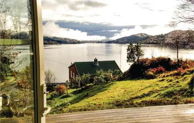 a view of a lake from a window at Stunning Home In Seim With Wifi in Seim