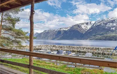 a view from a porch of a lake and mountains at 2 Bedroom Cozy Home In Vallavik in Vangsbygd
