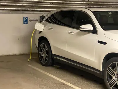 a white car is parked in a parking garage at Førde in Førde