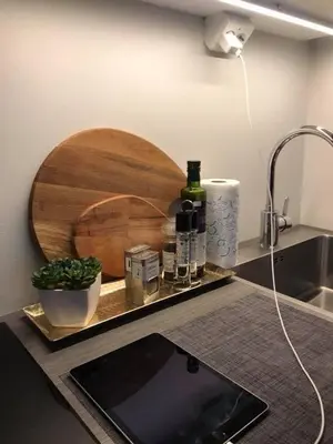 a kitchen counter with a sink and a cutting board at Førde in Førde