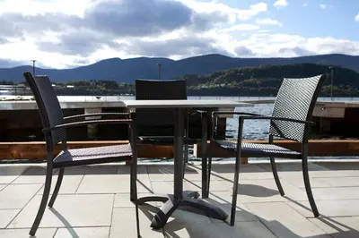 three chairs and a table on a roof at Quality Hotel Waterfront in Ålesund