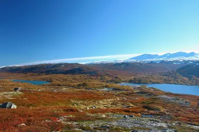 a view from the top of a mountain with a lake at Grotli Høyfjellshotell in Grotli