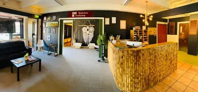 a lobby of a store with a large wooden counter at Sødorp Gjestgivergård Motell in Vinstra