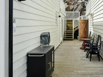 a trash can sitting on the side of a building at 8 person holiday home in Urangsvåg-By Traum in Ervik