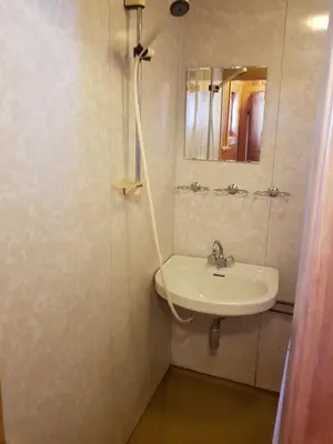 a bathroom with a sink and a mirror at Nybu Two-bedroom cottage in Geilo