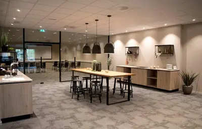 a conference room with a table and some chairs at Førde Hotel - Unike Hoteller in Førde