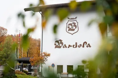 a building with a sign on the side of it at Bardøla Fjelltun in Geilo