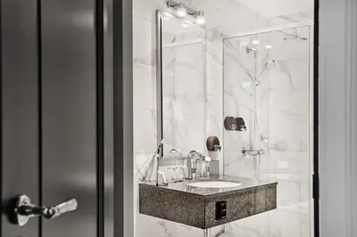 a bathroom with a sink and a mirror at Opus 16, a Member of Small Luxury Hotels in Bergen