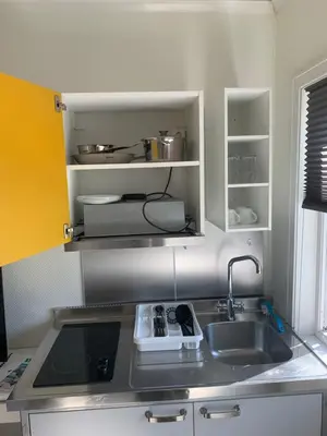a kitchen with a sink and a counter top at Brekstad Gjestehus AS in Brekstad