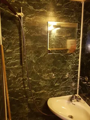 a bathroom with a sink and a mirror at Fjellbu Two-bedroom Cottage in Geilo