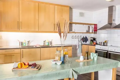 a kitchen with a counter with fruit on it at Flåm Hostel & Cabins in Flåm