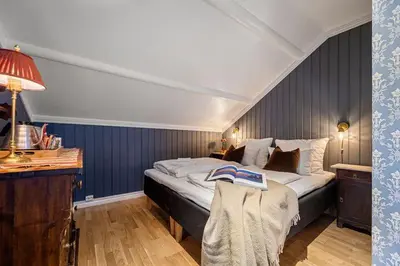 a bedroom with a large bed in a room at Tuddal Høyfjellshotel in Tuddal