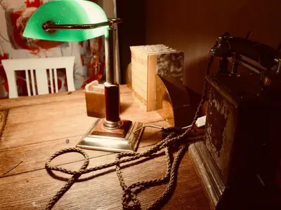 a desk with a lamp and a chain on it at Fosen Fjord Hotel in Å i Åfjord