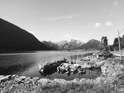 a black and white photo of boats in the water at Ålfotevegen 5 in Ålfoten