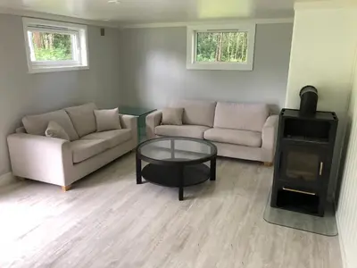 a living room with a couch and a coffee table at Voss Interlake in Skulestadmo
