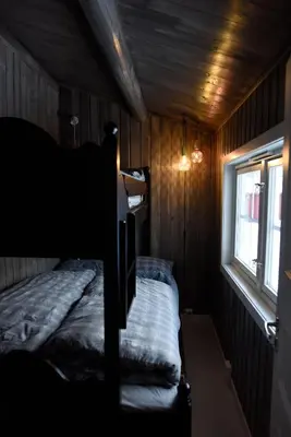 a bedroom with a bunk bed and a window at Fresh Familie Hytte Hemsedal with Outdoor Sauna in Hemsedal