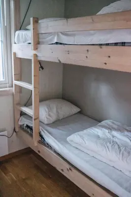 a couple of bunk beds in a room at Hovdehytta in Hovden