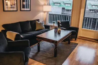 a living room with a couch and a coffee table at Hovdehytta in Hovden