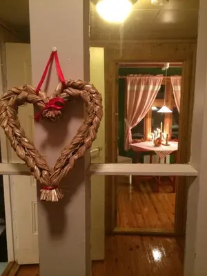a heart wreath hanging on a wall in a room at Skjerping gård in Lonevåg