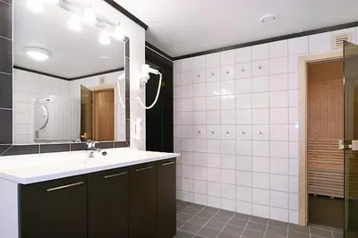 a bathroom with a sink and a mirror at Alpin Apartments Sørlia in Hafjell