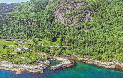 an aerial view of a resort on a mountain near the water at 3 Bedroom Cozy Home In Lavik in Lavik