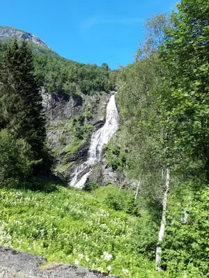 a waterfall on the side of a mountain at Stalheim Fjord og Fjellhytter in Stalheim