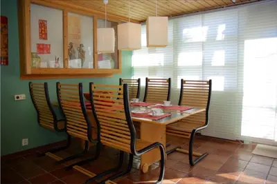 a dining room with a table and chairs at Hardanger Feriesenter Nesvika in Norheimsund