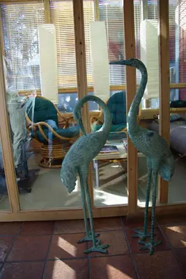 two statues of birds standing in front of a mirror at Hardanger Feriesenter Nesvika in Norheimsund