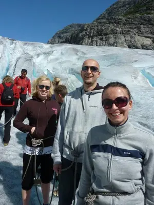 a group of people standing in front of a glacier at Eikum Hotel in Hafslo