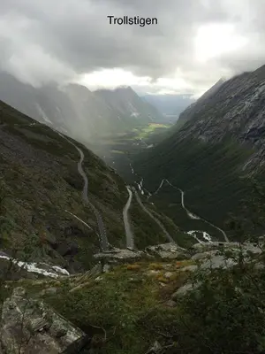a winding mountain road in a valley in the mountains at Awesome Fishing, Boating and Nature Experience at Fiskesenter Birkeland in Rekdal