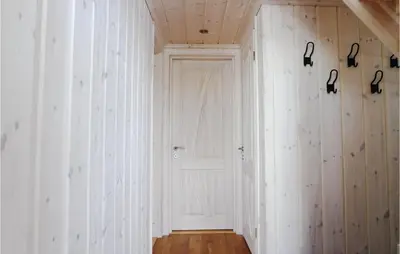 a hallway with white walls and a white door at Cozy Home In Lillehammer With Wifi in Lillehammer