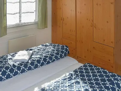 a bedroom with a bed and a window at 6 person holiday home in Aukra in Aukra
